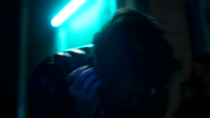 Man gets hit in the face in an alley at night