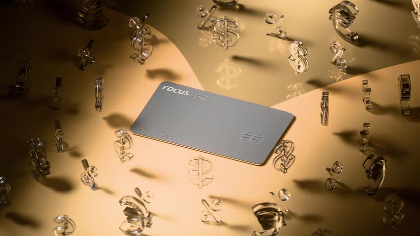 A computer generated animation of various major currency logos rotating around a bouncing bank card