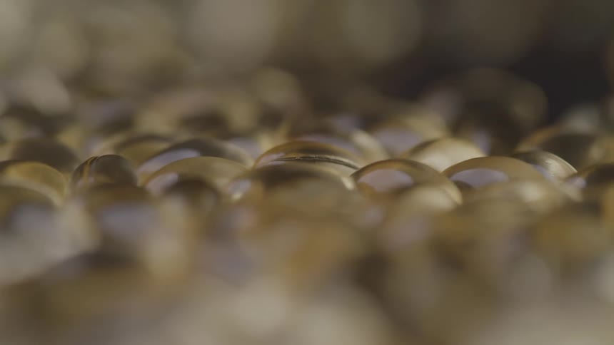 The pile of gel caps are slowly turning