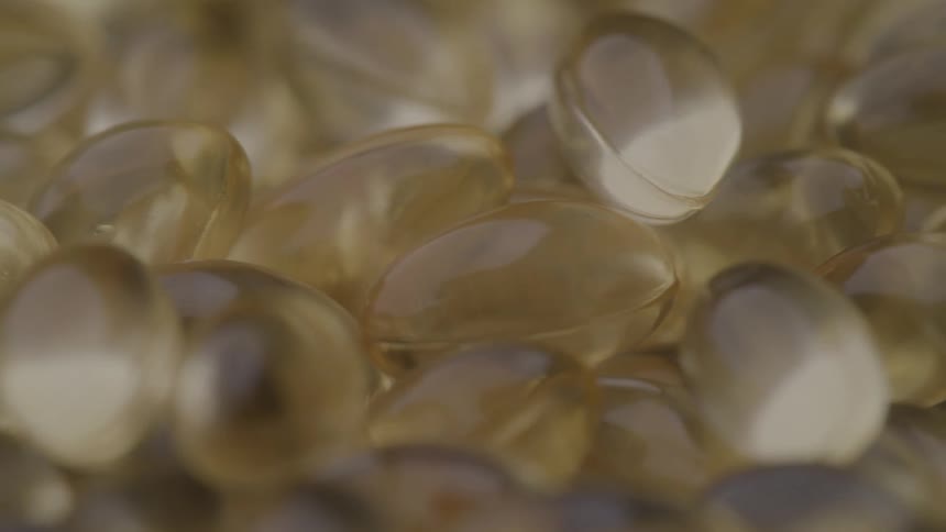 Transparent supplement capsules in closeup