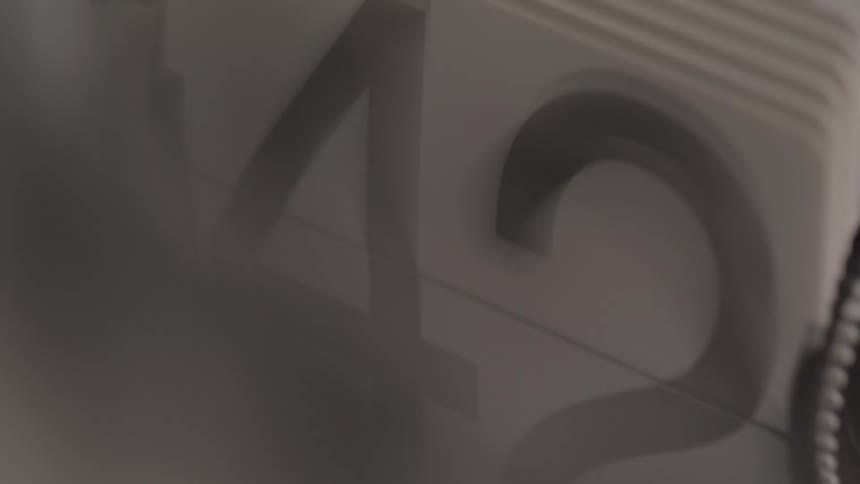 The numbers flip on the spindle of cards