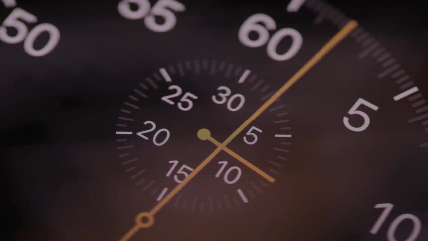 Extreme close up of a working analogue watch dial
