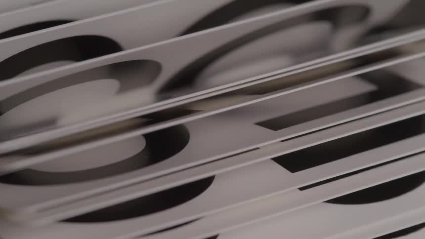 The stack of papers with numbers is flipping