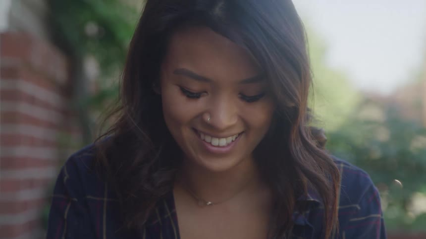 Close up portrait of a young woman outdoors during daytime