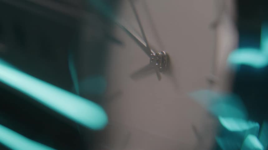 The hands on the clock turn around together