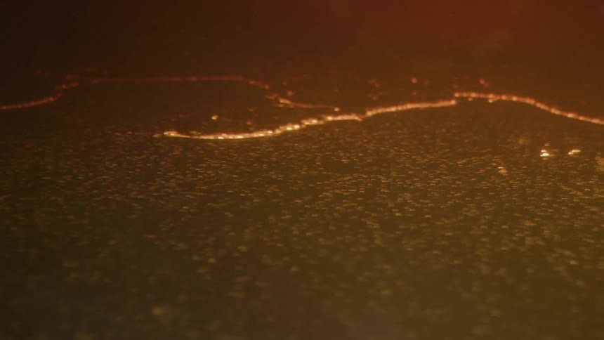 Orange reflection of the sun on the grounds surface