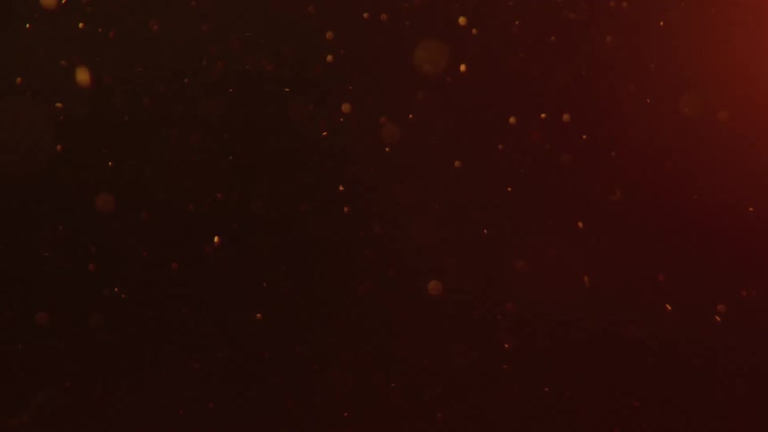 In a closeup shot more liquid is poured into a glass causing a turbulent cascade of fastmoving bubbles to erupt from the bottom