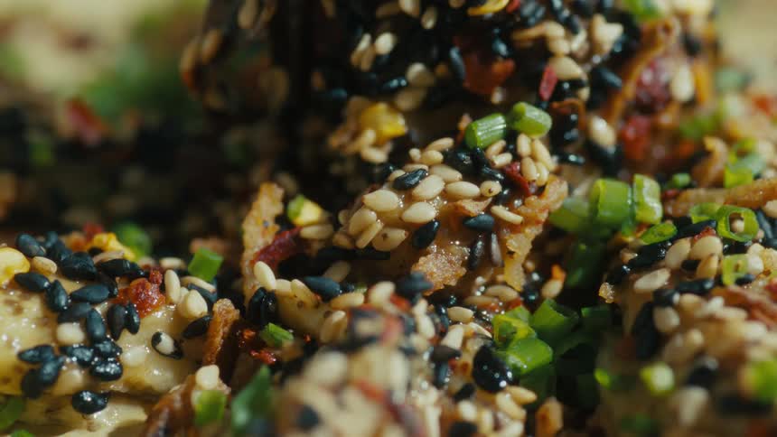 A close up of the ingredients in furikake seasoning sprinkled onto food