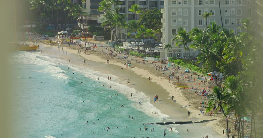 The beach is crowded with people