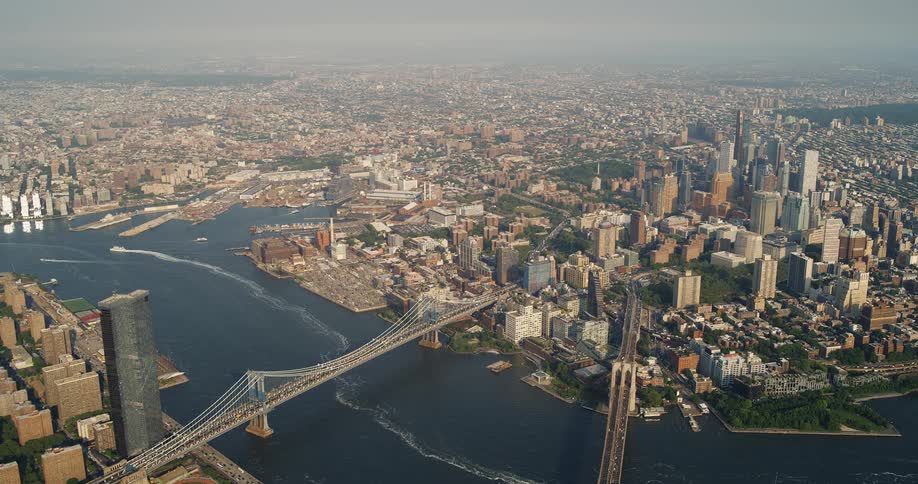 Aerial view of new york shows bridges over the river and skyscrapers in the background