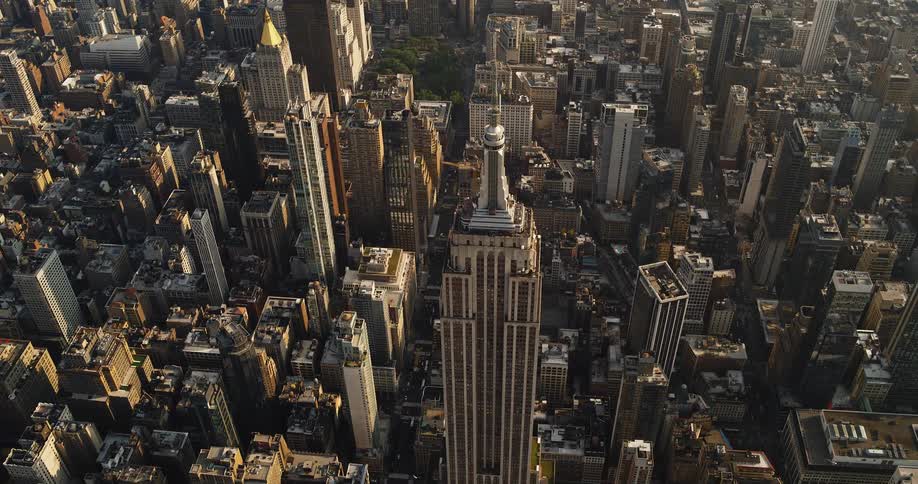 The Empire State Building in New York City - A tall tower is at the center of the metropolis