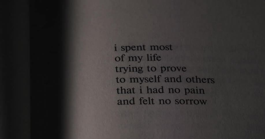 The video shows a page of a book with text on it the text says i spent most of my life trying to prove to myself and others that i had no pain and felt no sorrow the video is from filmsupply