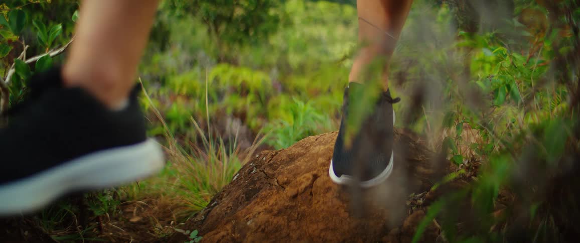 The woman is hiking in the wild