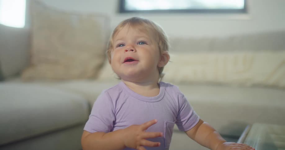 The baby is laughing at home
