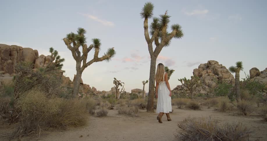 The woman is hiking in the canyon