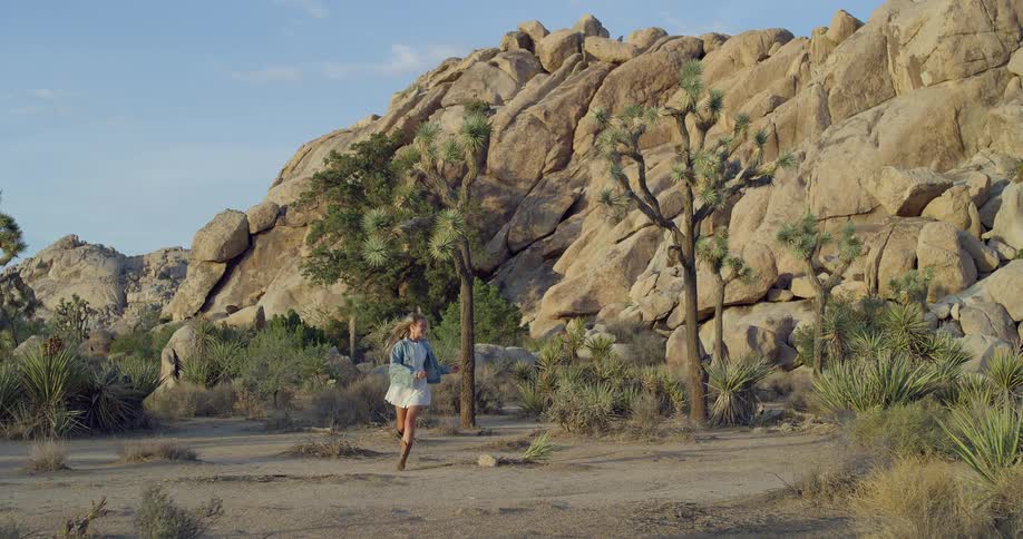 The woman runs from the canyon