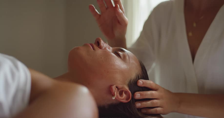 The woman receives a massage on her face