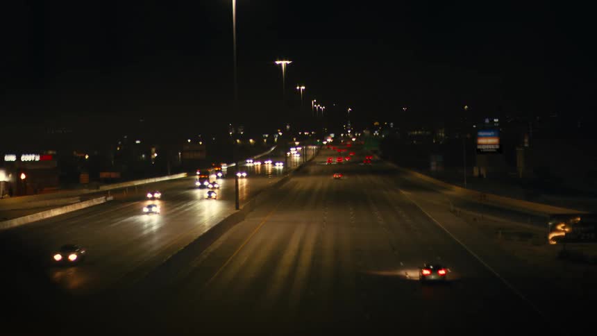 Traffic flows on the freeway at night