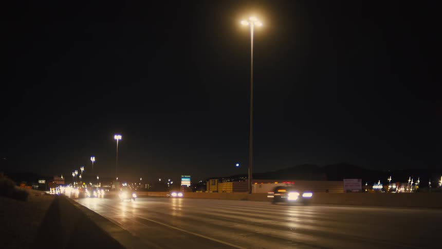 Time lapse of commuters on a freeway at night
