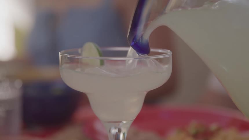 The glass is filled with a drink