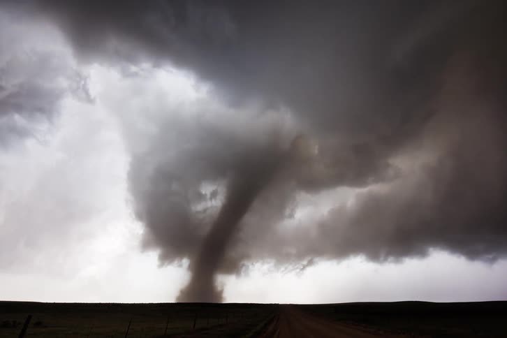 A time lapse shows storm clouds and a spinning tornado