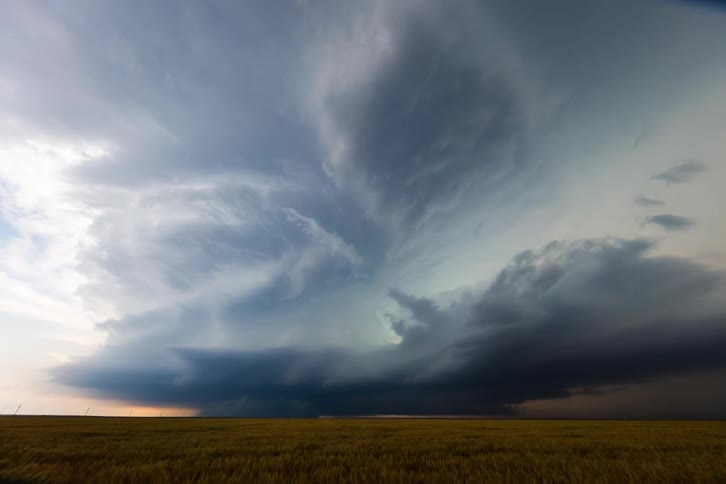 A large storm forms in the distance