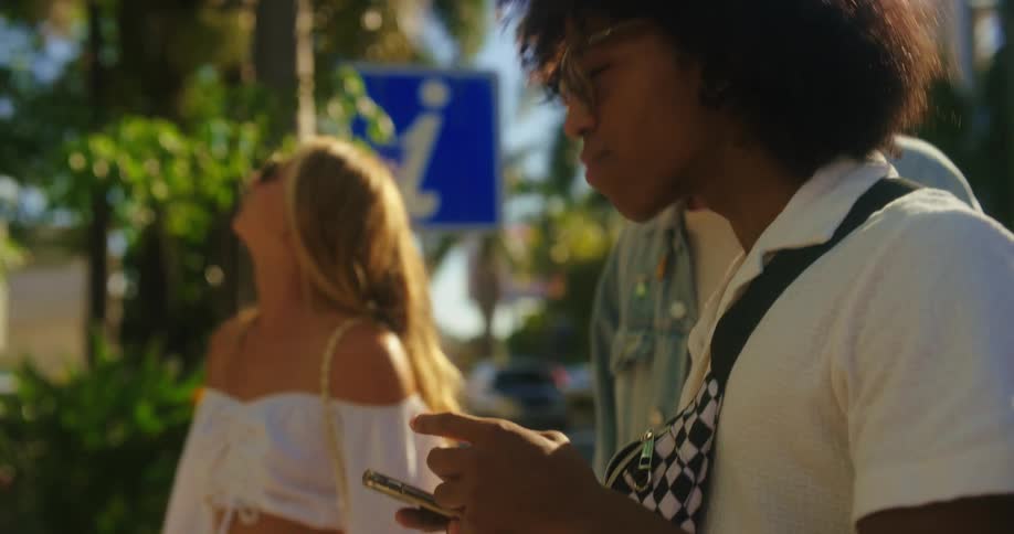 Three friends walking around the city outdoors during the day