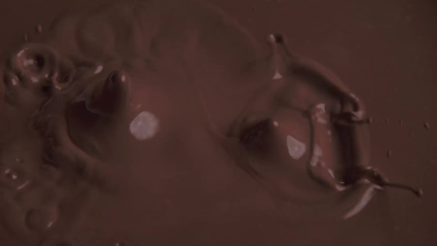 The chocolate sauce splashes when something falls in