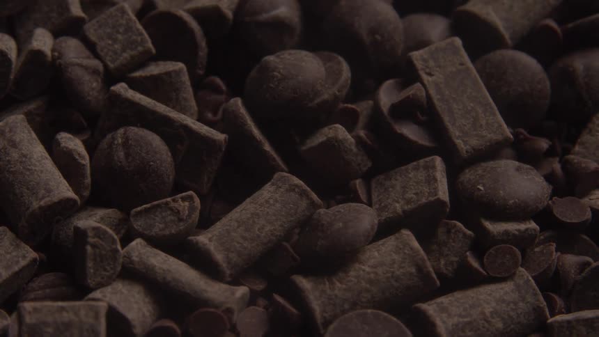 A pile of chocolate pieces are spinning