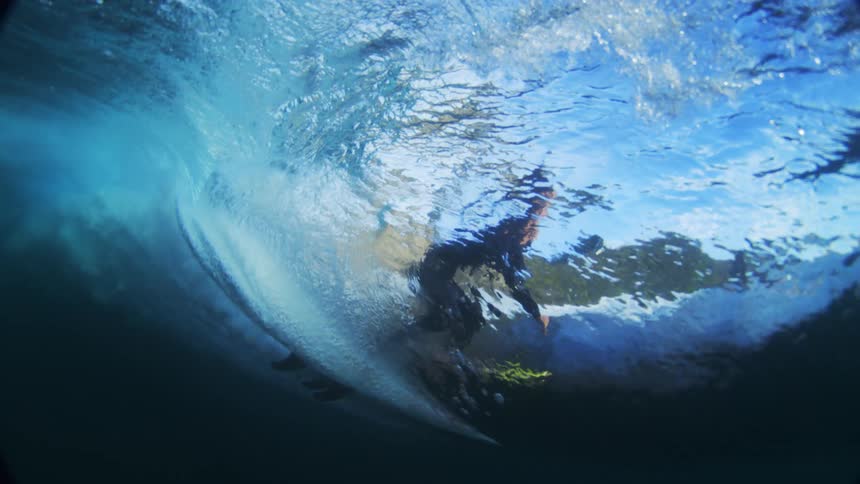 The man is surfing above the water
