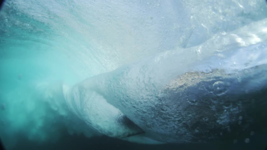 Underwater view of a breaking tubular wave in the ocean