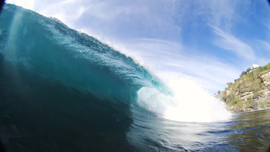 Breaking wave curls near the coast
