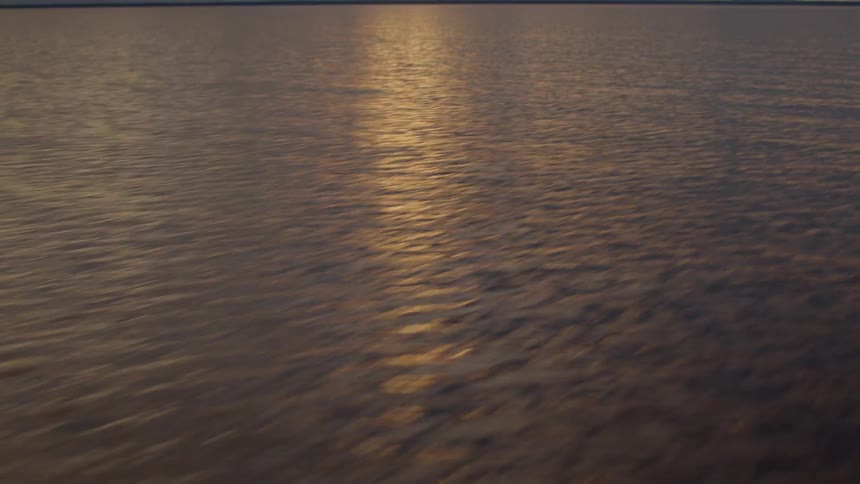 Ocean and clouded sky during dusk or dawn