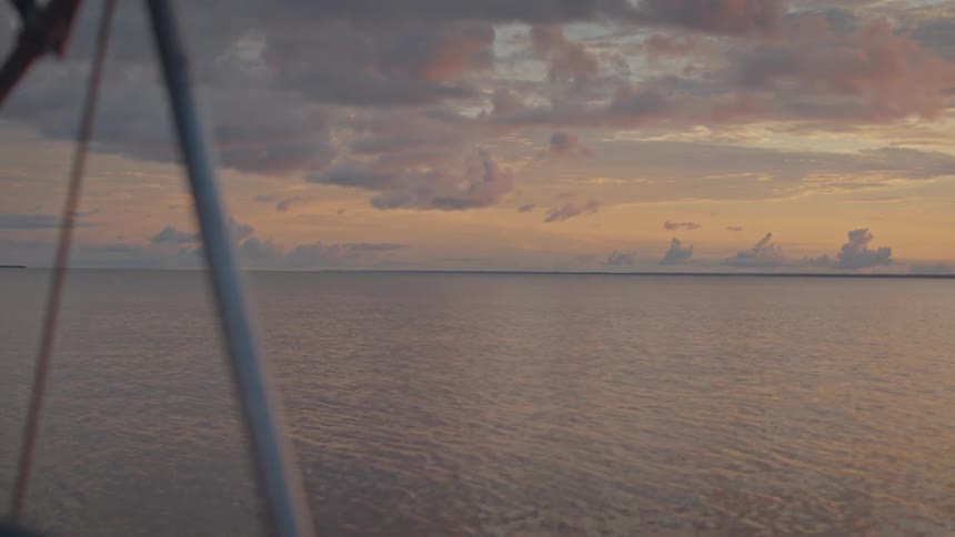 The sun rises over the water