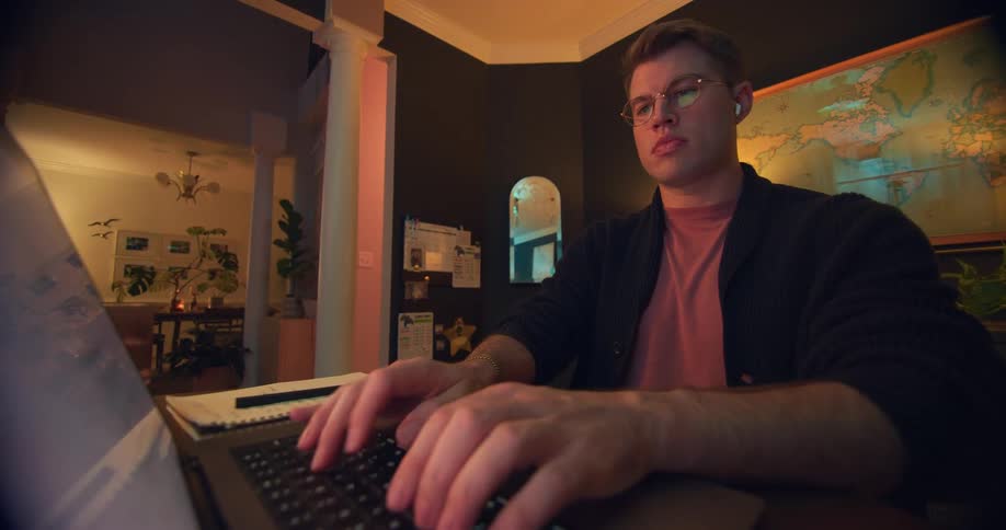 Man sitting typing on a laptop
