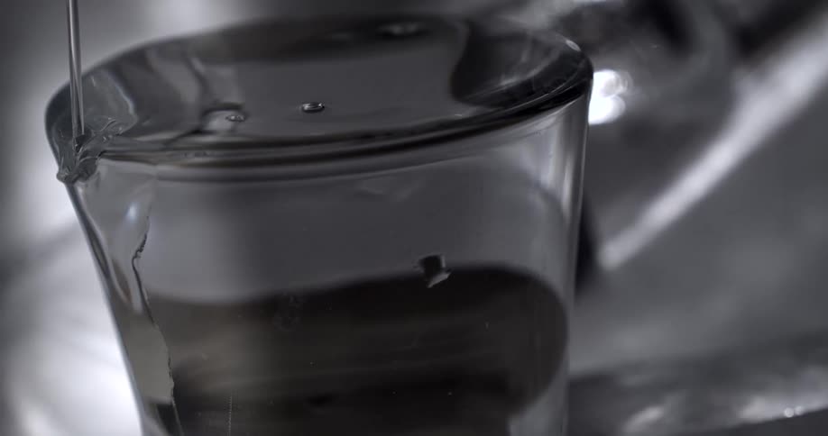 The glass is overfilled with water