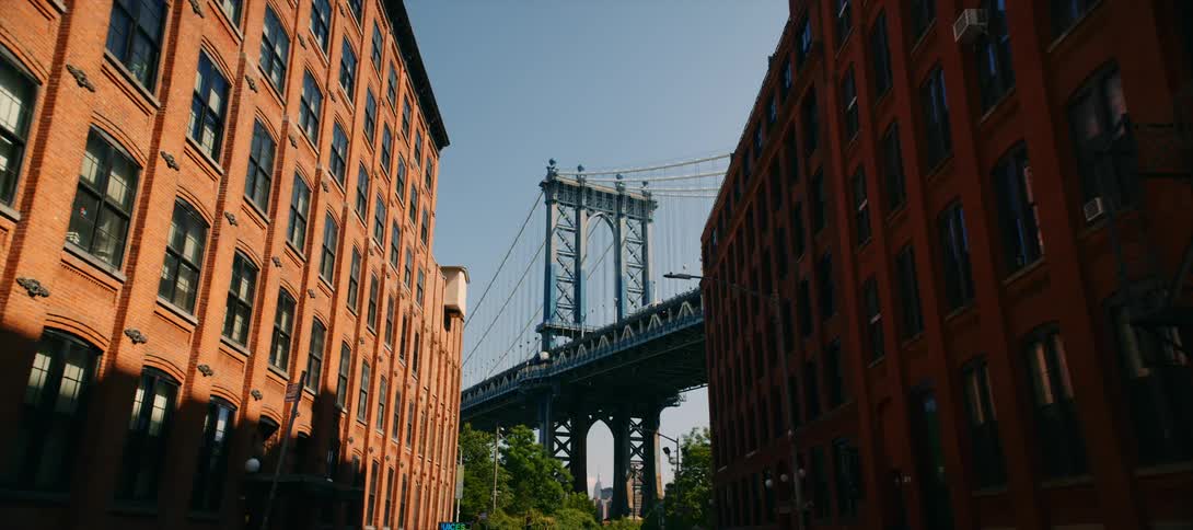 An overhead bridge in the city within a residential neighborhood at midday
