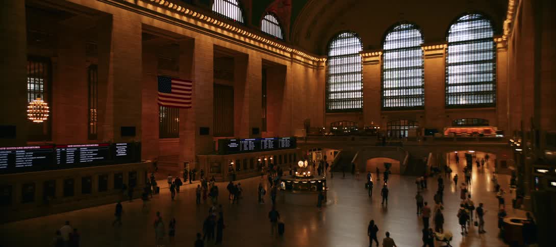 Numerous people are walking through grand central terminal in new york