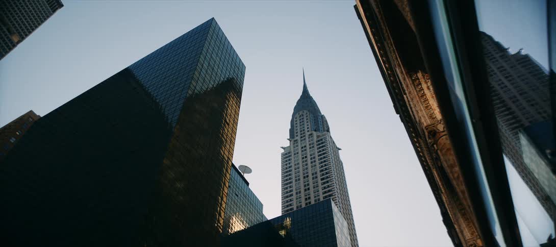Downtown building facades reflect the nearby buildings during the daytime