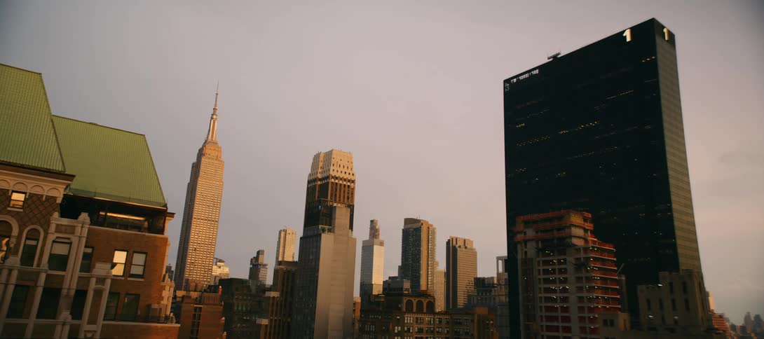 A view of city skyscrapers and the skyline at sunset