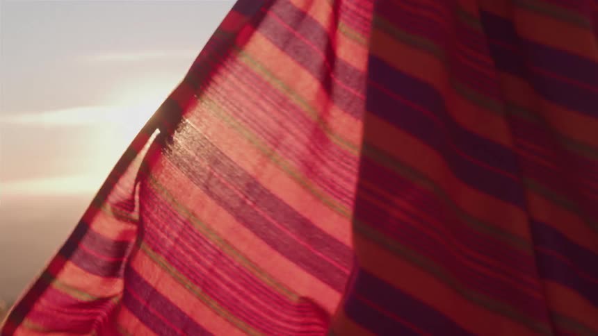 Wind blows the robe on the field