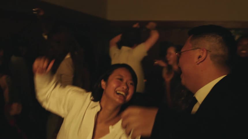 The people spin and dance in the busy nightclub