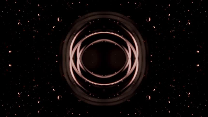 An abstract animation shows a symmetrical design of interconnected circles and lines on a dark background the shapes which are a mix of light brown and gray contract and expand as they rotate