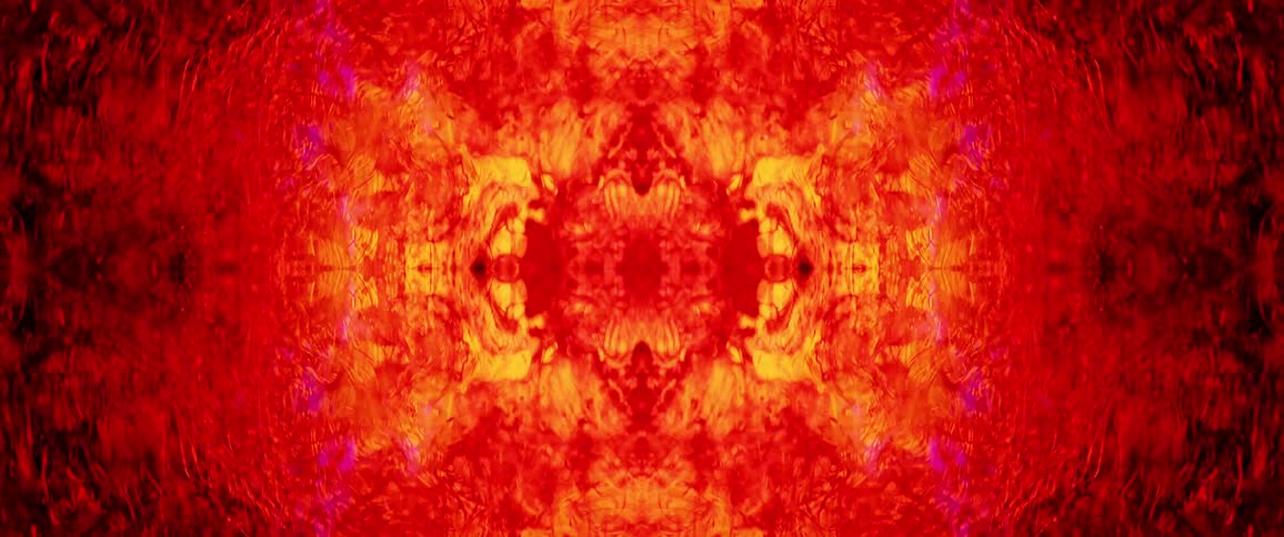 An abstract animation of vibrant red and orange colors pulsates on a black background looking like fire or lava the design is symmetrical and the colors swirl and flow dynamically
