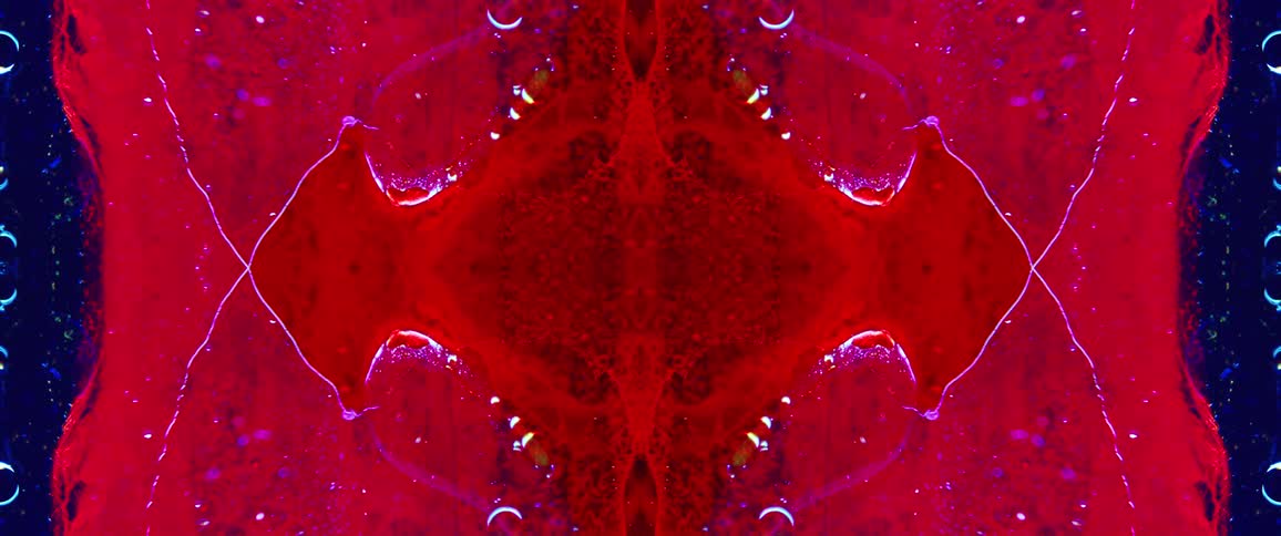Abstract symmetrical pattern in vibrant shades of red and blue