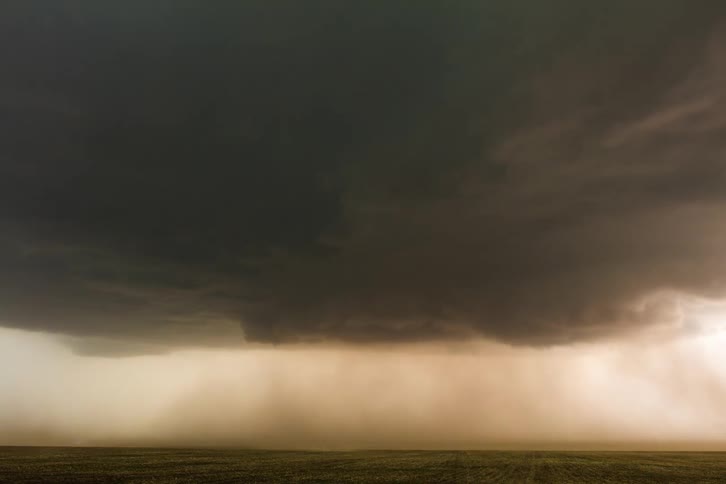 A large rain storm with heavy wind is on the landscape