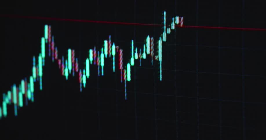 Red and green candlestick chart on a pixelated screen with RGB pixels as the bearish graph breaks resistance to the downside and the market or asset value collapses causing massive losses and volatility due to an unexpected crash