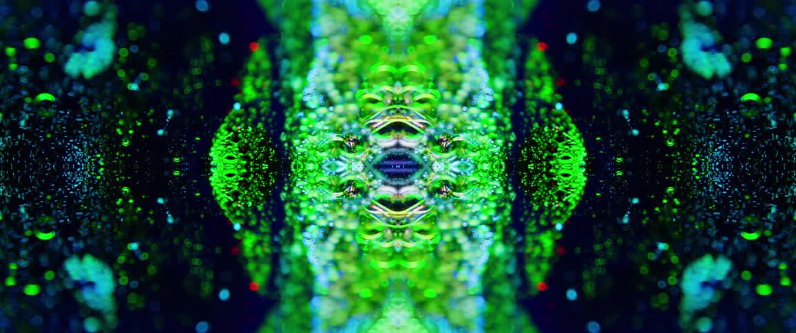 The bubbles move around the green liquid