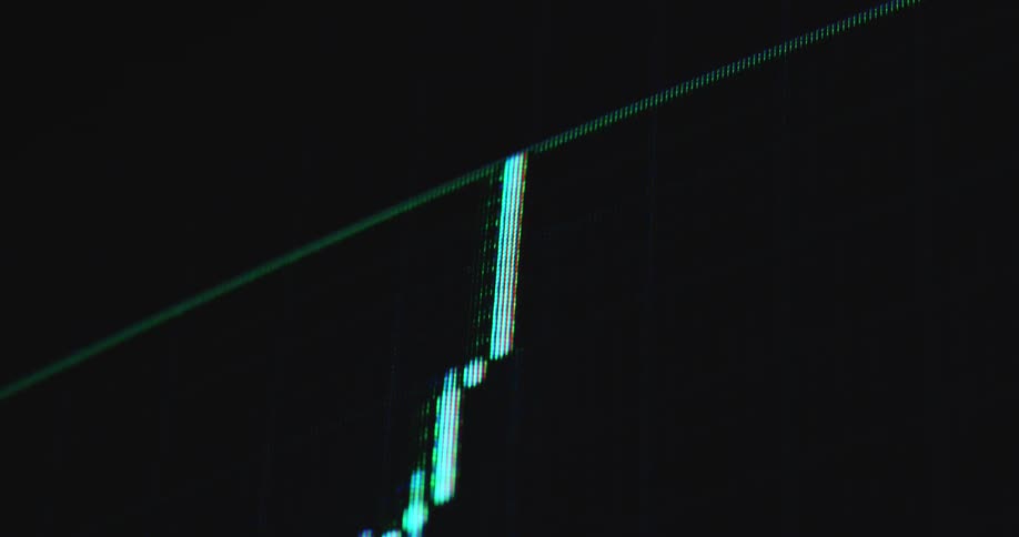 Looking up onto retro computer screen or monitor displaying a trading chart candlestick animation consisting of long green candles as the price increases and the broker or trader makes a successful trade with lots of profit and the stock reaches new ATH