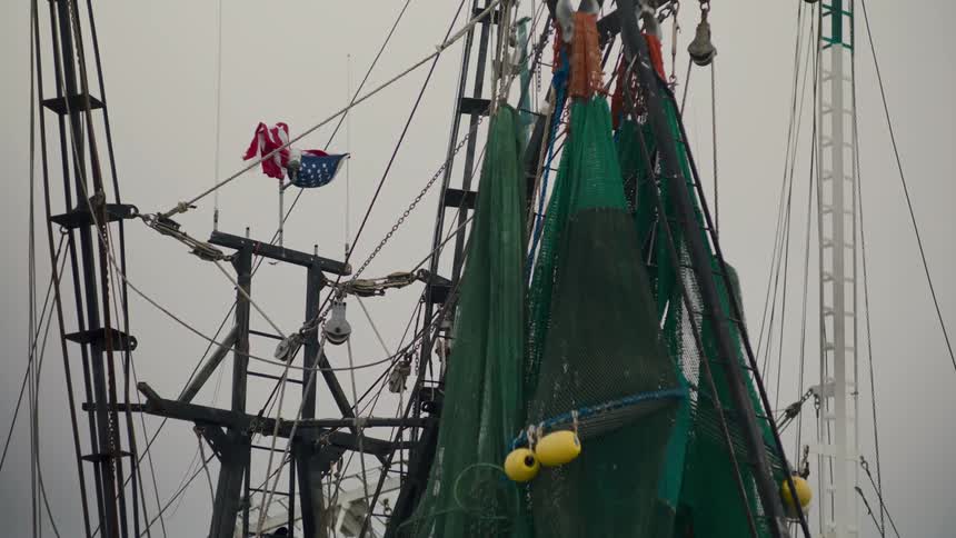 Nets hang above a fishing vessel